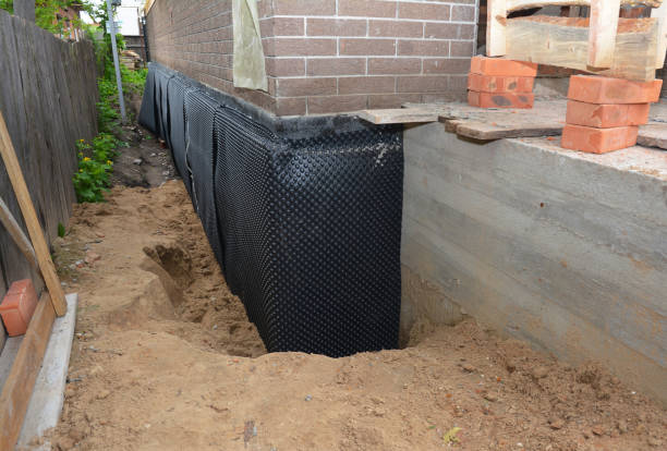 Happy homeowners after waterproofing job in Marion